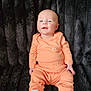 Amir joined the competition — help win amazing prizes! baby, infant, child, smiling, sitting, orange_clothing, white_shoes, plush_blanket, texture, portrait, cute, happy, indoor, soft, young, small, fashion, footwear, cozy, comfortable