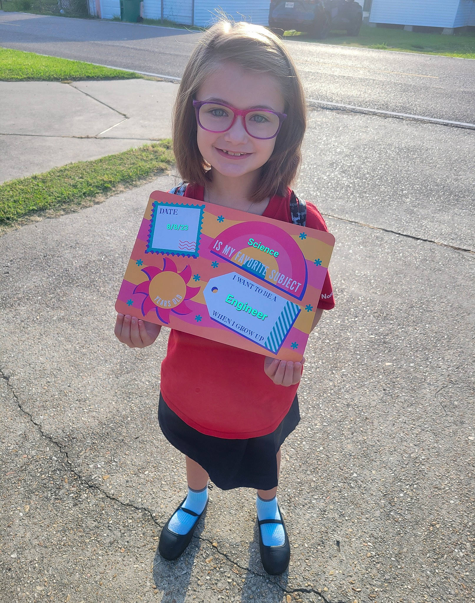 Alexandra is registered to the contest to win money with this photo: asphalt, baby_toddler_clothing, denim, electric_blue, face, footwear, fun, grass, hair, hairstyle, happy, head, joy, pattern, person, pink, shorts, sleeve, smile, summer