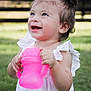 toddler, child, smile, happy, outdoor, grass, pink_sippy_cup, white_dress, baby, cute, drinking, holding, topknot, young_child, sunlight, portrait, nature, daylight, hands, playful