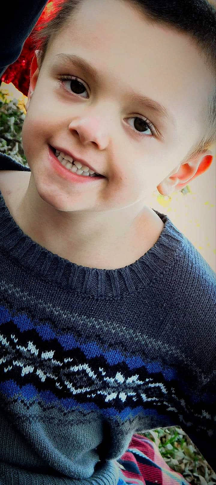 Trevor joined the competition — help win amazing prizes! cheek, child, chin, close_up, eye, face, facial_expression, head, joy, knitting, lip, mouth, neck, nose, outerwear, person, skin, smile, textile, toddler