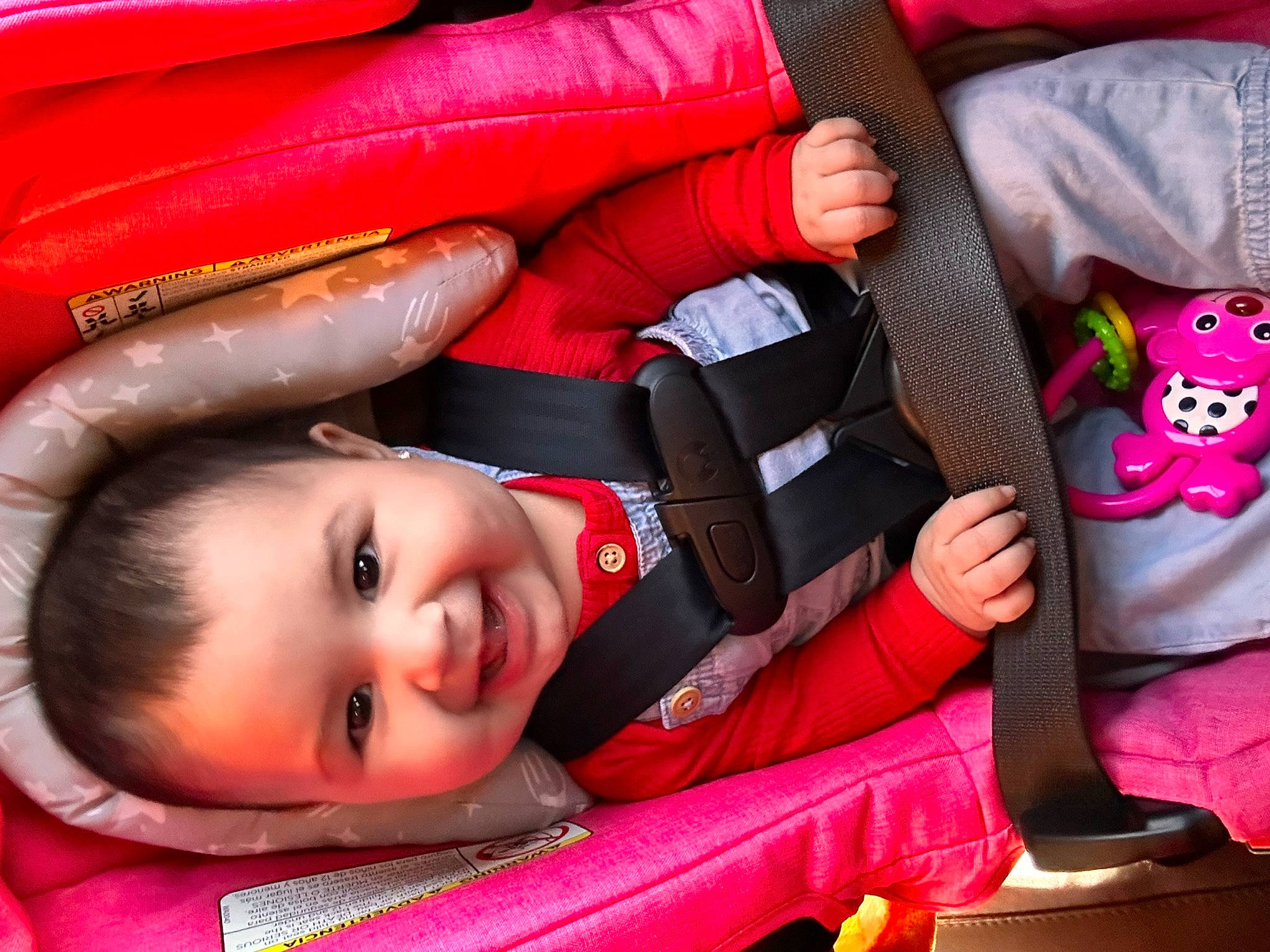 Lila is registered to the contest to win money with this photo: auto_part, baby, baby_carriage, baby_products, car_seat, carmine, child, comfort, flash_photography, fun, happy, joy, magenta, pattern, person, pink, product, red, smile, textile