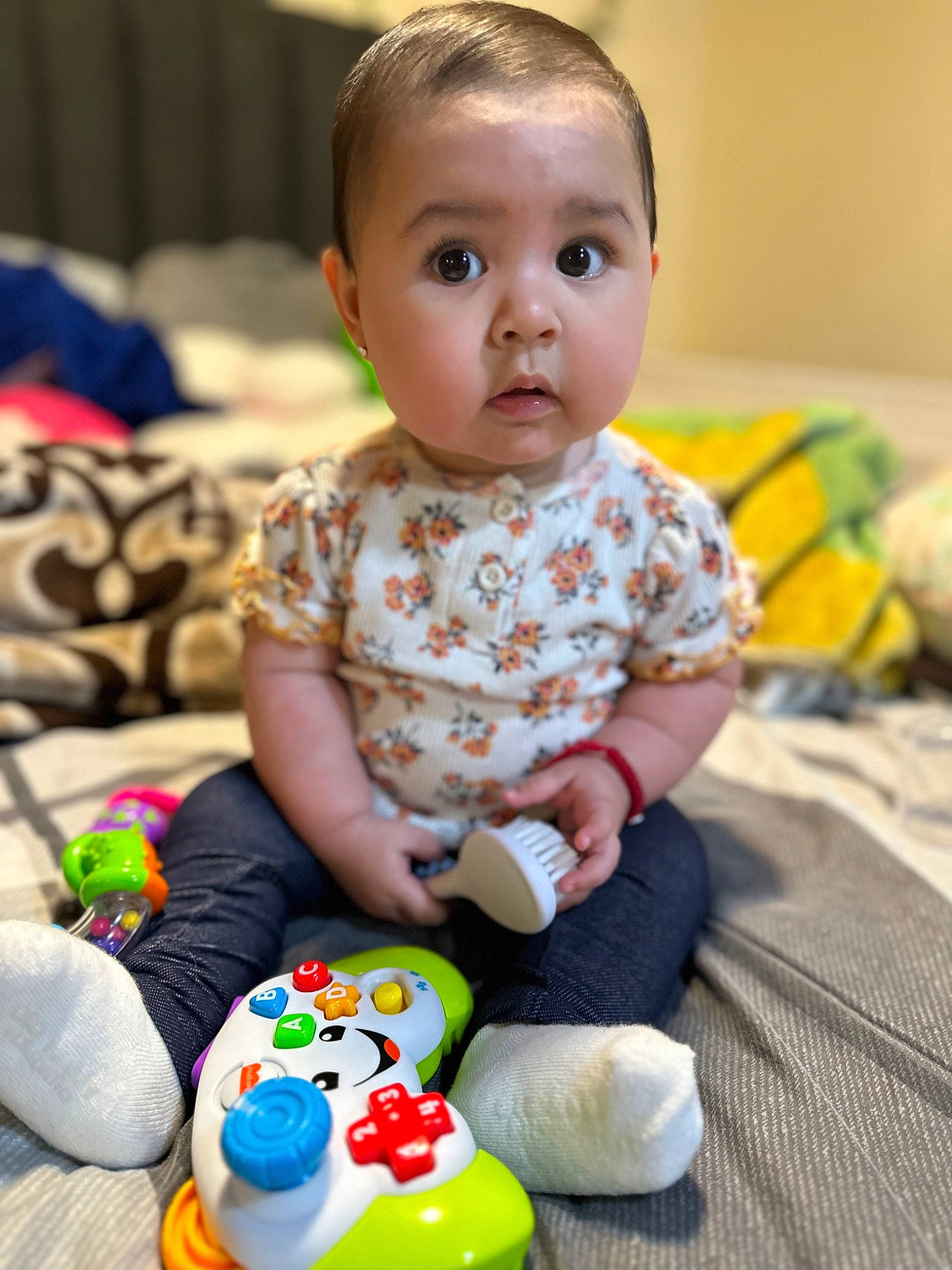 Lila joined the competition — help win amazing prizes! arm, baby, baby_playing_with_toys, baby_toddler_clothing, cheek, child, comfort, eye, facial_expression, fun, happy, head, pattern, people, person, product, sitting, skin, sleeve, surprise
