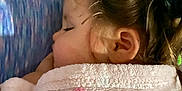 Maya is registered to the contest to win money with this photo: child, sleeping, blanket, pillow, bedtime, face, ear, hair, indoors, cozy, peaceful, resting, soft, comfort, person, portrait, closeup, head, sleep, toddler
