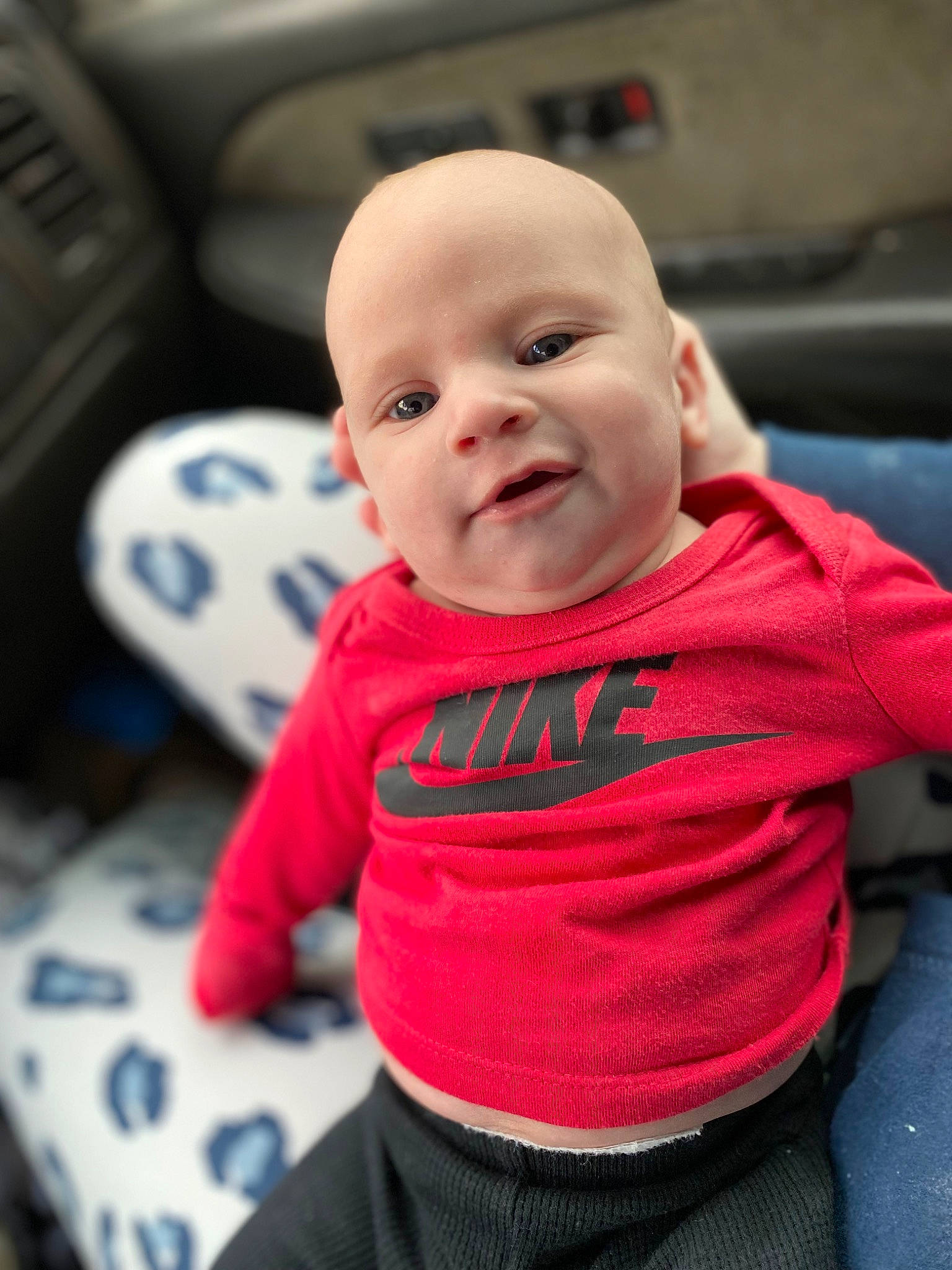 Kashtyn joined the competition — help win amazing prizes! auto_part, automotive_design, baby, baby_toddler_clothing, carmine, cheek, child, comfort, cool, eye, facial_expression, fun, happy, mouth, person, sitting, skin, sleeve, smile, t_shirt