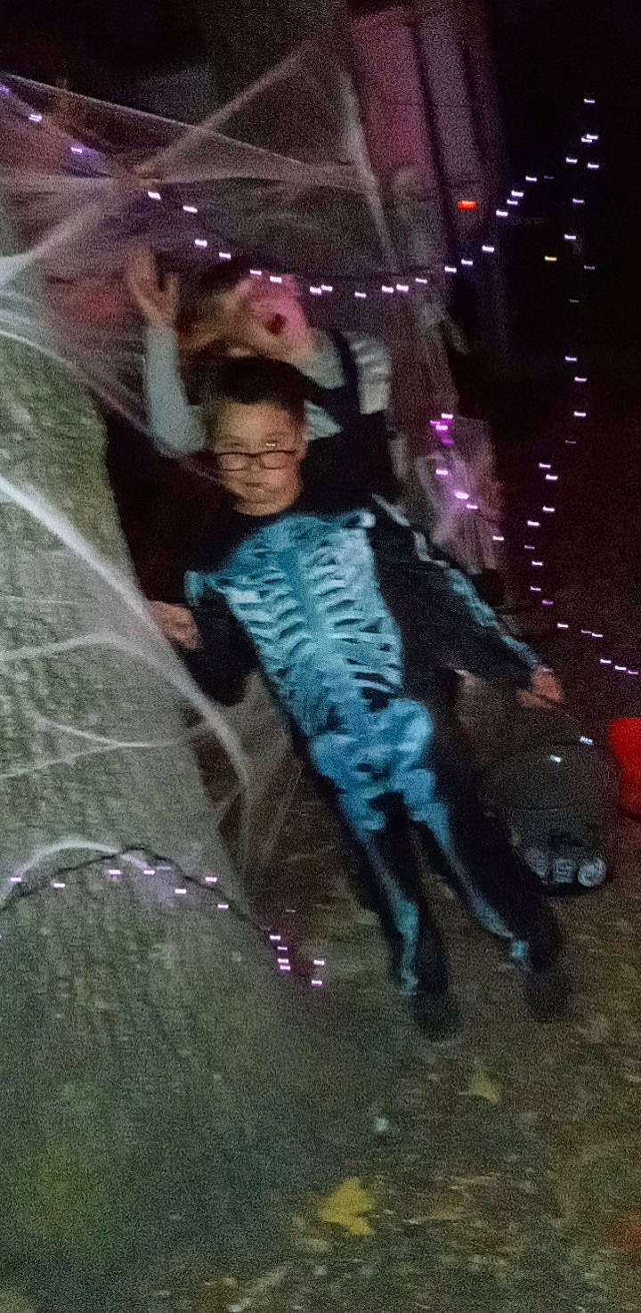 Hunter is registered to the contest to win money with this photo: art, costume, darkness, event, fashion_accessory, fictional_character, fun, glass, leisure, magenta, midnight, night, person, precipitation, purple, rain, tree, winter