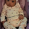 Hera is registered to the contest to win money with this photo: baby, infant, child, clothing, headband, sitting, seat, purple, cute, portrait, indoors, looking, person, newborn, apparel, footwear, cozy, small, face, hands