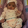 baby, infant, child, car_seat, purple, clothing, hat, onesie, socks, cute, indoors, seat, patterned_clothing, portrait, young_child, person, resting, comfortable, looking_at_camera, small_hands