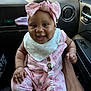 Paris joined the competition — help win amazing prizes! baby, infant, smiling, pink_clothing, headband, bow, car_interior, seat, adult_hand, pacifier_clip, cute, happy, child, sitting, clothing, pattern, butterfly, white_socks, closeup, portrait