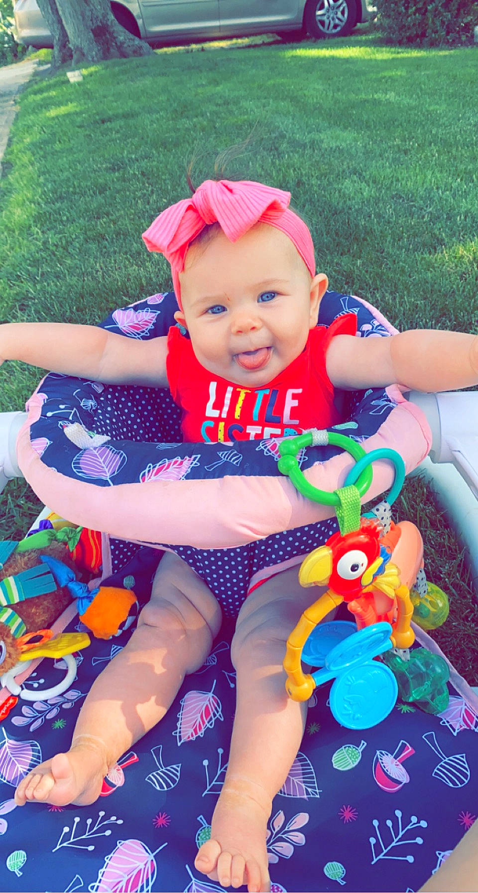 Luna joined the competition — help win amazing prizes! baby, baby_products, baby_toddler_clothing, child, electric_blue, fun, grass, happy, hat, lap, leisure, person, pink, plant, recreation, red, smile, summer, thigh, toddler