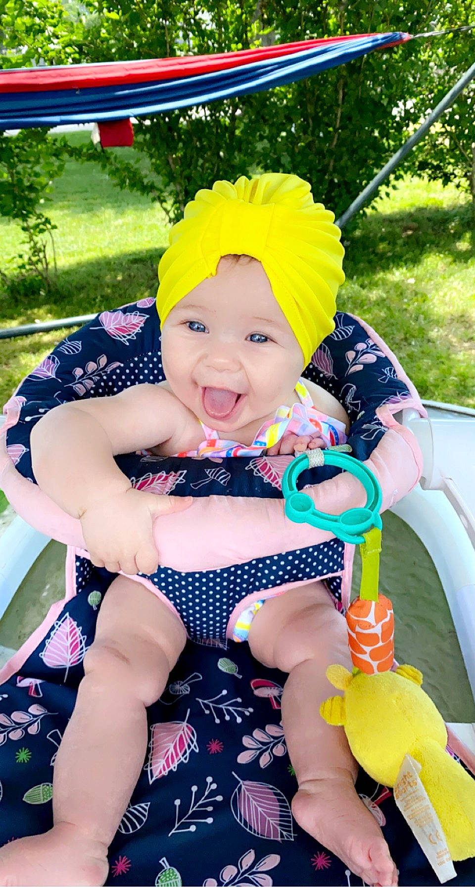 Luna joined the competition — help win amazing prizes! baby_toddler_clothing, blue, facial_expression, fun, grass, happy, headwear, leg, leisure, person, personal_protective_equipment, pink, plant, purple, recreation, skin, smile, thigh, toddler, tree
