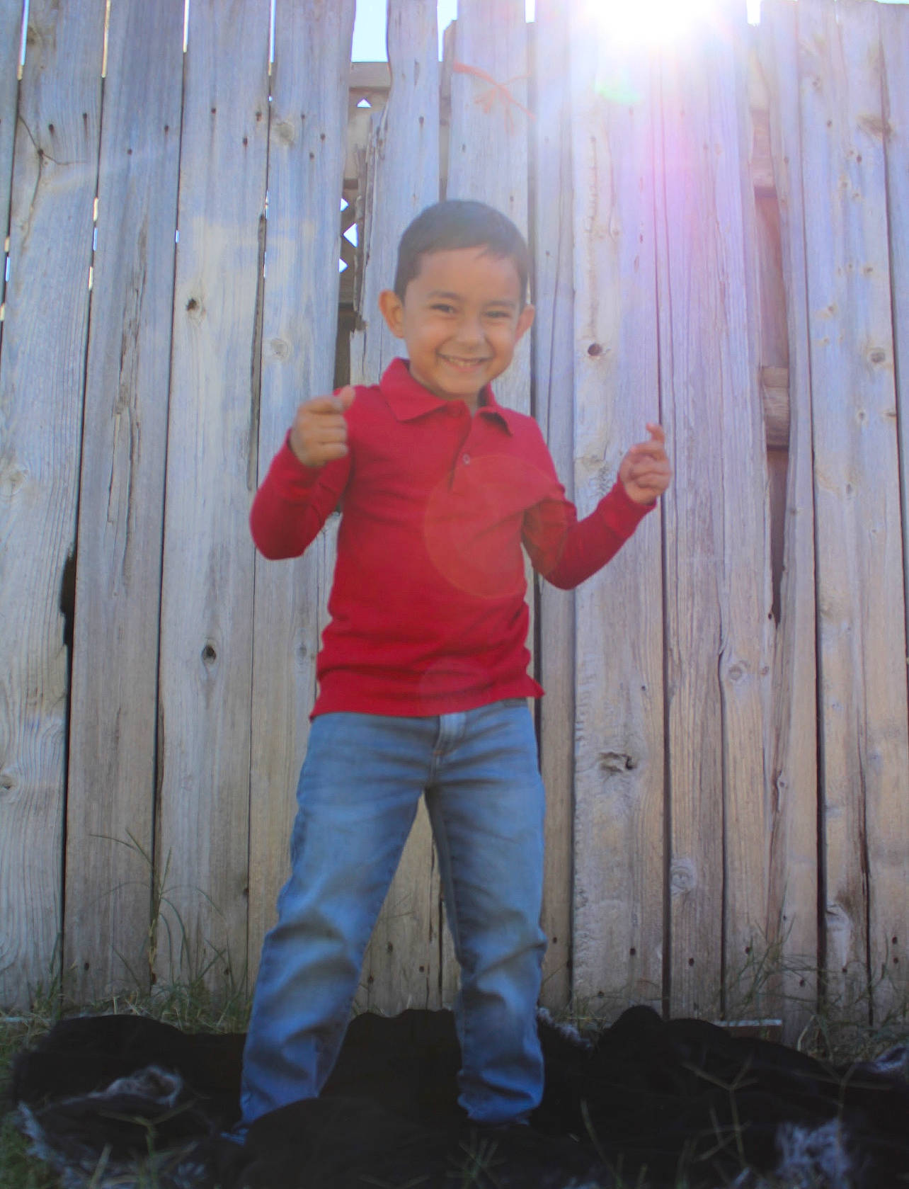 Gabriel joined the competition — help win amazing prizes! baby_toddler_clothing, child, denim, face, fence, fun, grass, happy, head, home_fencing, joy, people_in_nature, person, sitting, sleeve, smile, soil, standing, t_shirt, thumb