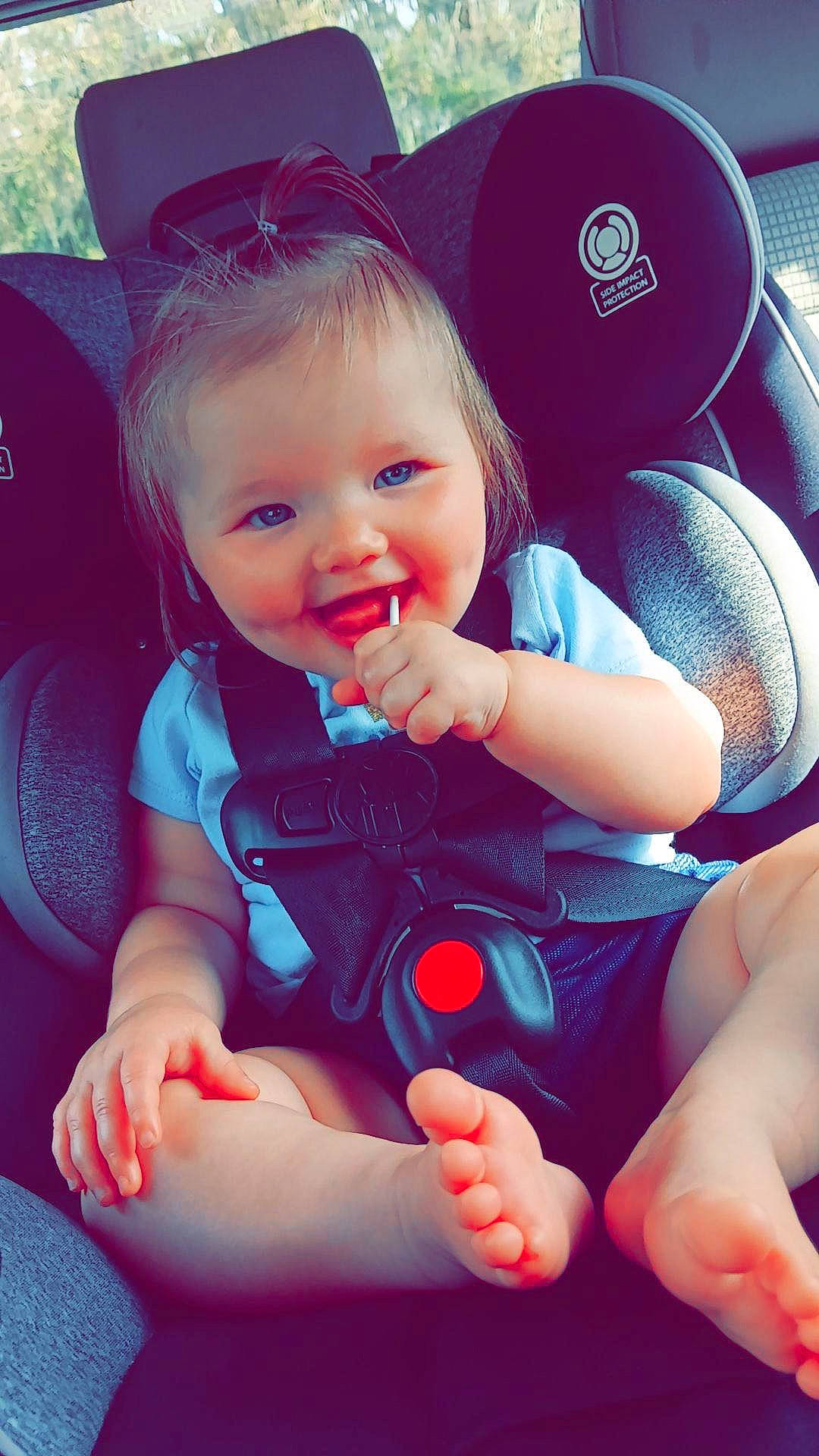 Raelynn joined the competition — help win amazing prizes! baby, baby_toddler_clothing, car_seat, child, comfort, cool, face, finger, gesture, hand, happy, joy, mouth, person, product, skin, smile, steering_wheel, thigh, thumb
