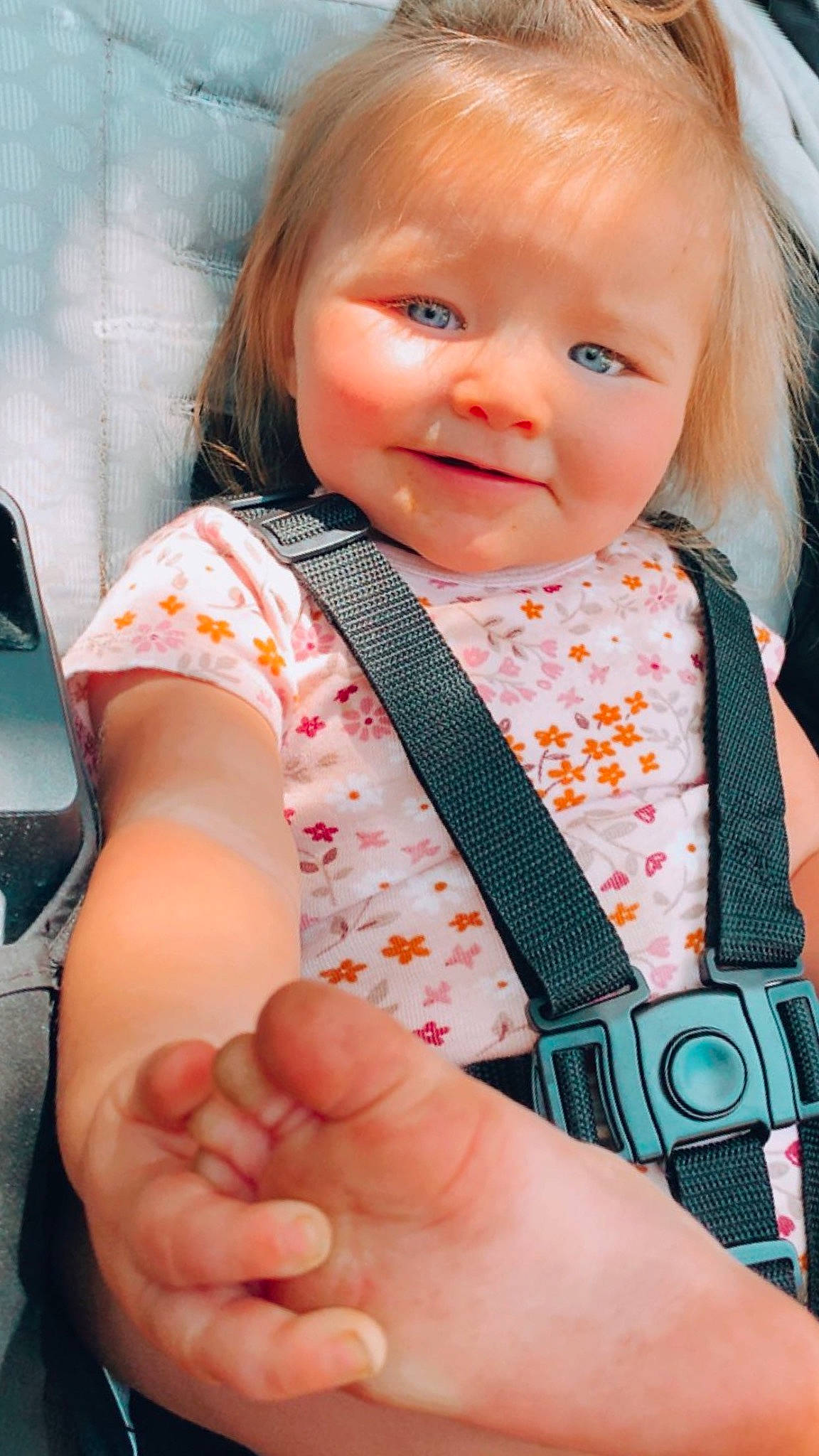Raelynn is registered to the contest to win money with this photo: baby_toddler_clothing, cheek, collar, dress, face, facial_expression, finger, gesture, hand, happy, head, human_body, joy, lip, nose, person, pink, skin, sleeve, smile