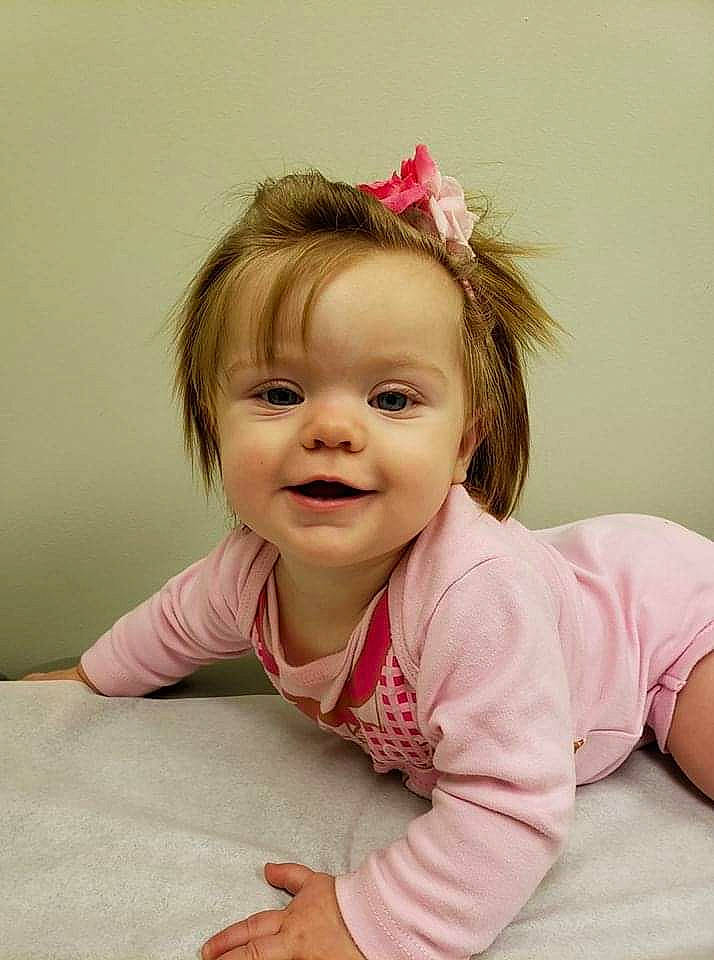 Everlea is registered to the contest to win money with this photo: beauty, brown_hair, cheek, child, child_model, ear, eye, fun, girl, hair, hairstyle, happiness, human_hair_color, infant, person, pink, sitting, skin, smile, textile