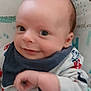 Dougie is registered to the contest to win money with this photo: baby, smiling, face, infant, clothing, bib, cute, closeup, child, young, portrait, happy, expression, skin, head, hand, sleeve, indoors, person, babywear