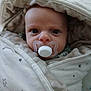 Dougie joined the competition — help win amazing prizes! baby, pacifier, blanket, wrapped, face, infant, wide_eyes, expression, cute, indoor, soft, star_pattern, newborn, child, cozy, portrait, baby_clothing, head, closeup, sleepwear