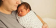 Josiah is registered to the contest to win money with this photo: baby, blanket, care, comfort, cozy, family, gentle, holding, indoor, love, mother, newborn, polka_dot, portrait, skin, sleeping, soft_light, swaddle, tenderness, woman