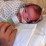 Josiah is registered to the contest to win money with this photo: newborn, baby, infant, feeding, bottle, nasal_tube, hand, blanket, hospital, medical, care, person, face, bed, rest, closeup, healthcare, patient, treatment, support