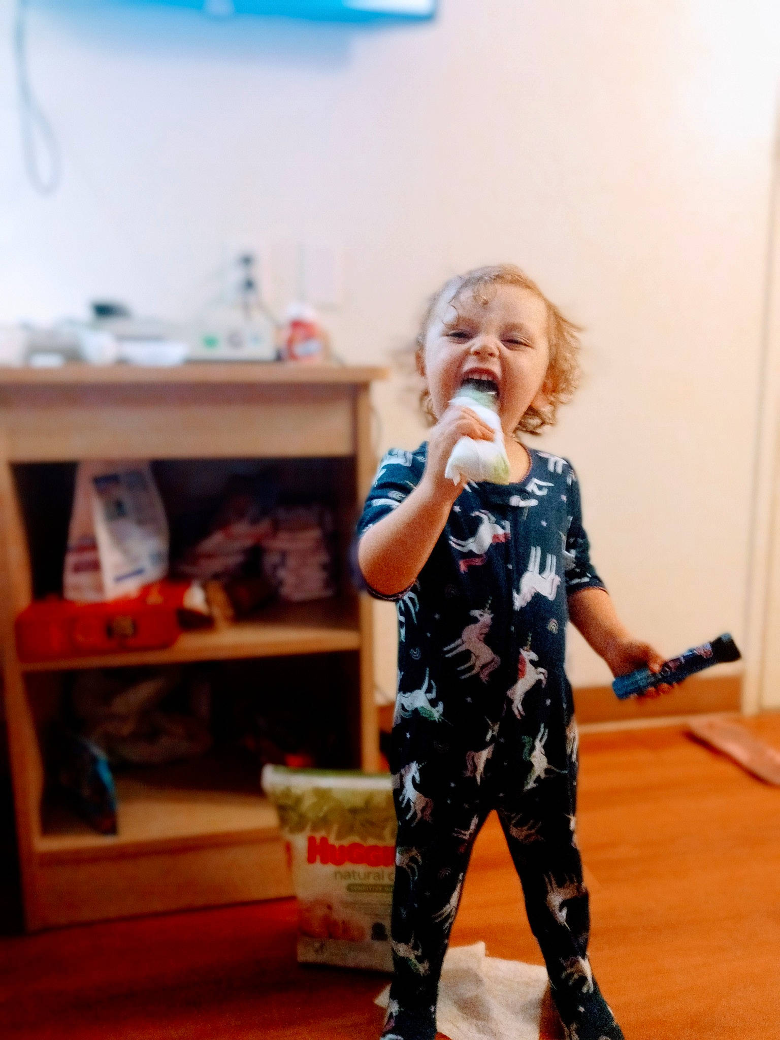 Paisley is registered to the contest to win money with this photo: baby, baby_toddler_clothing, blond, child, face, fashion_design, flooring, fun, happy, hardwood, human_leg, knee, leg, pattern, person, room, sleeve, standing, thigh, toddler