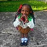 Zabria is registered to the contest to win money with this photo: backpack, black_shoes, braids, brown_skirt, child, concrete, daylight, front_yard, grass, hair_bows, happy, nature, outdoor, peace_sign, person, residential_area, smiling, standing, white_socks, white_sweater