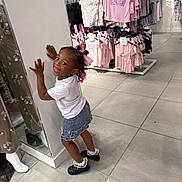 Zabria joined the competition — help win amazing prizes! apparel, black_shoes, child, clothing_store, cute, denim_skirt, floor_tiles, girl, hair_accessories, hanger, mirror, pink_clothes, playful, posing, rack, retail, shopping, smiling, store_interior, white_tshirt
