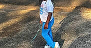 Zabria joined the competition — help win amazing prizes! asphalt, blue_pants, casual_clothing, chain, child, daytime, girl, green_bow, happy, nature, outdoor, pavement, playful, shadow, sidewalk, smile, sneakers, standing, sunlight, white_shirt