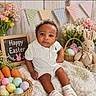 baby, easter, eggs, basket, plush_bunny, flowers, blanket, child, cute, holiday, spring, decorations, smiling, white_clothing, indoors, celebration, soft_toys, carrots, portrait, festive