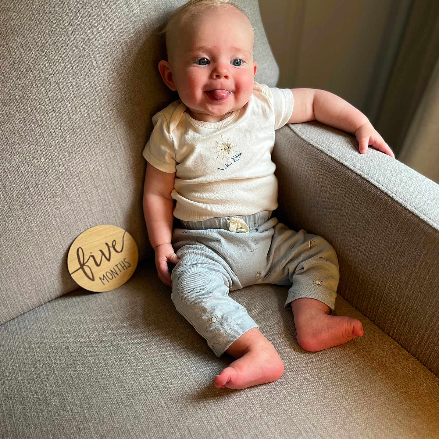 Asher is registered to the contest to win money with this photo: baby, babylaughing, chair, clothing, couch, cushion, face, furniture, happy, head, homedecor, jeans, laughing, pants, person, photography, portrait, sitting, smile, t_shirt