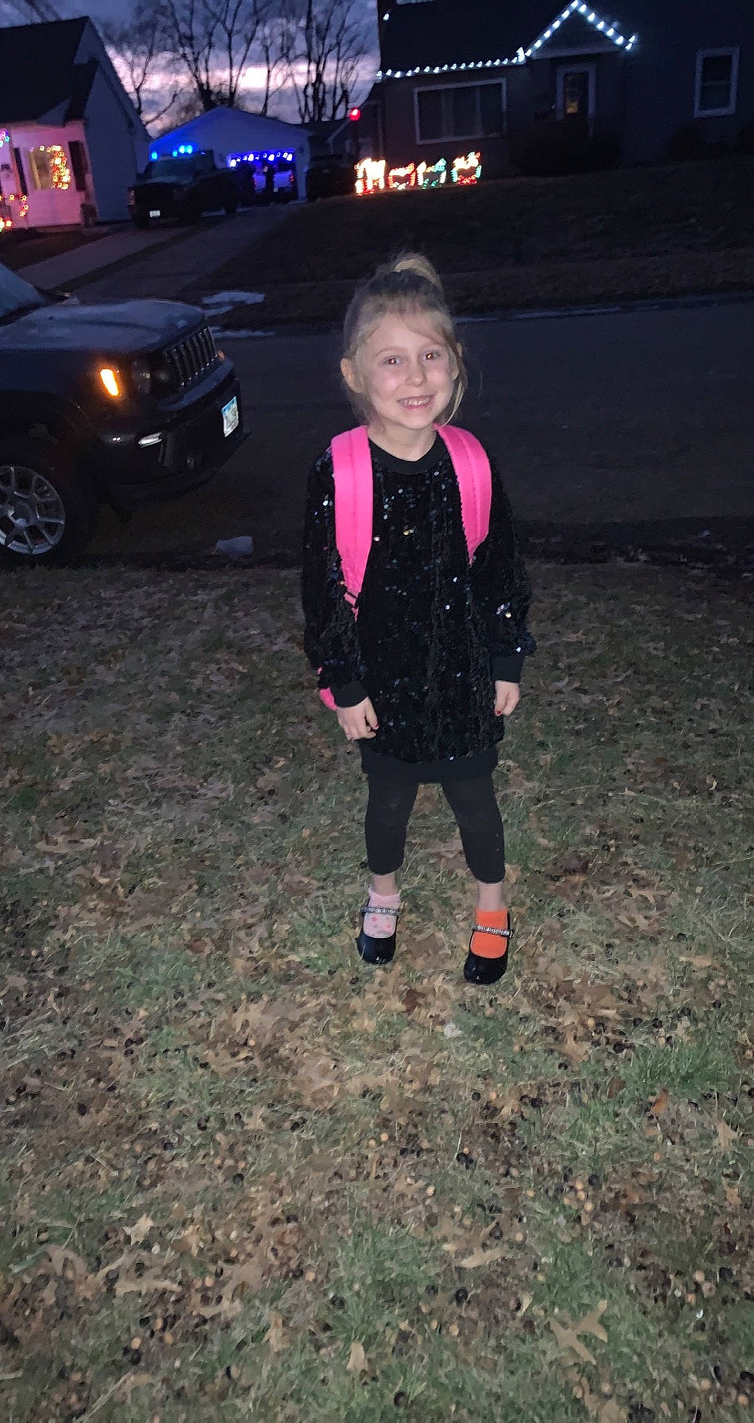 Lilah is registered to the contest to win money with this photo: asphalt, automotive_design, automotive_exterior, automotive_lighting, automotive_tire, automotive_wheel_system, bumper, car, electric_blue, event, face, headlamp, joy, motor_vehicle, person, personal_luxury_car, rim, smile, tire, toddler