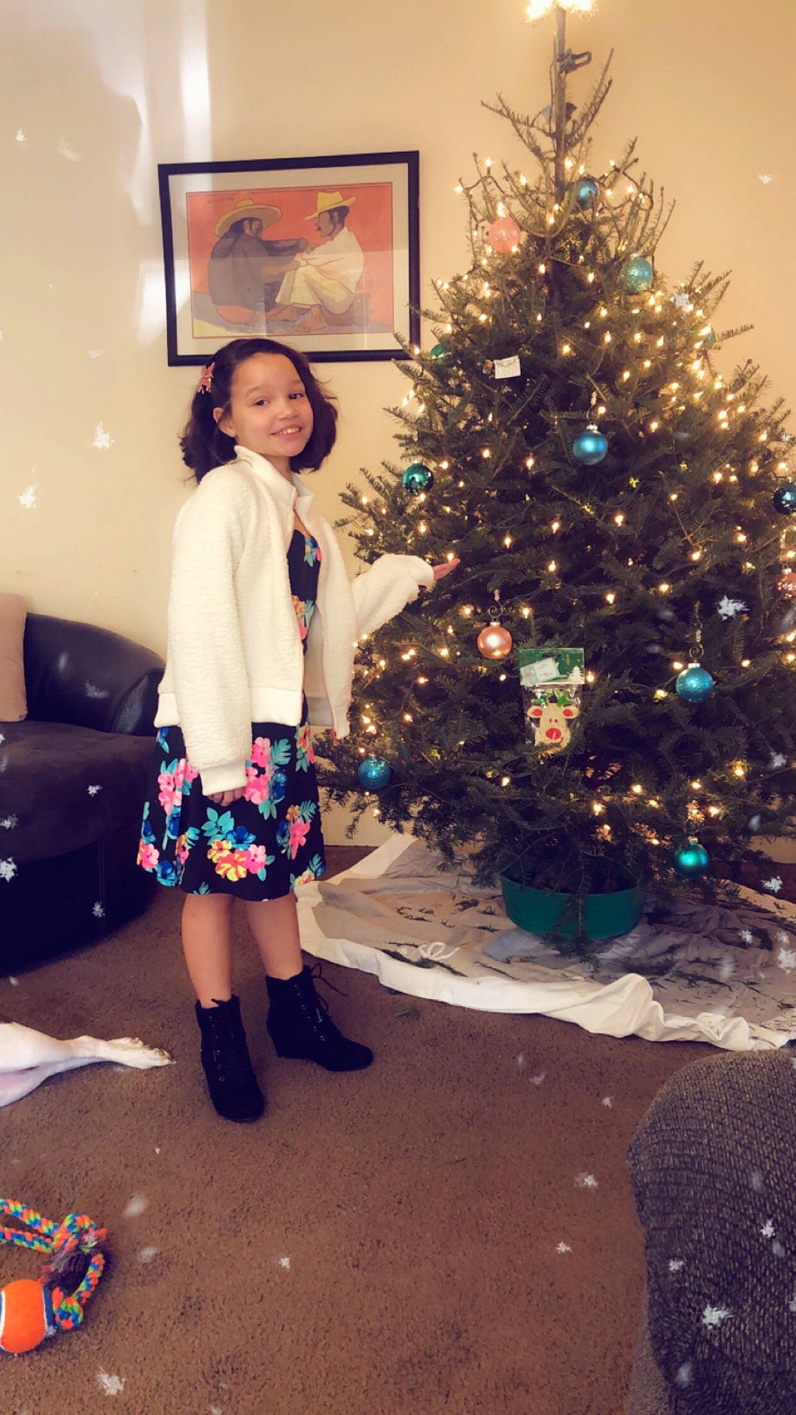 Leona is registered to the contest to win money with this photo: beauty, christmas_decoration, christmas_ornament, christmas_tree, event, evergreen, fawn, fun, happy, holiday_ornament, joy, knee, long_hair, ornament, person, plaid, plant, standing, street_fashion, tartan