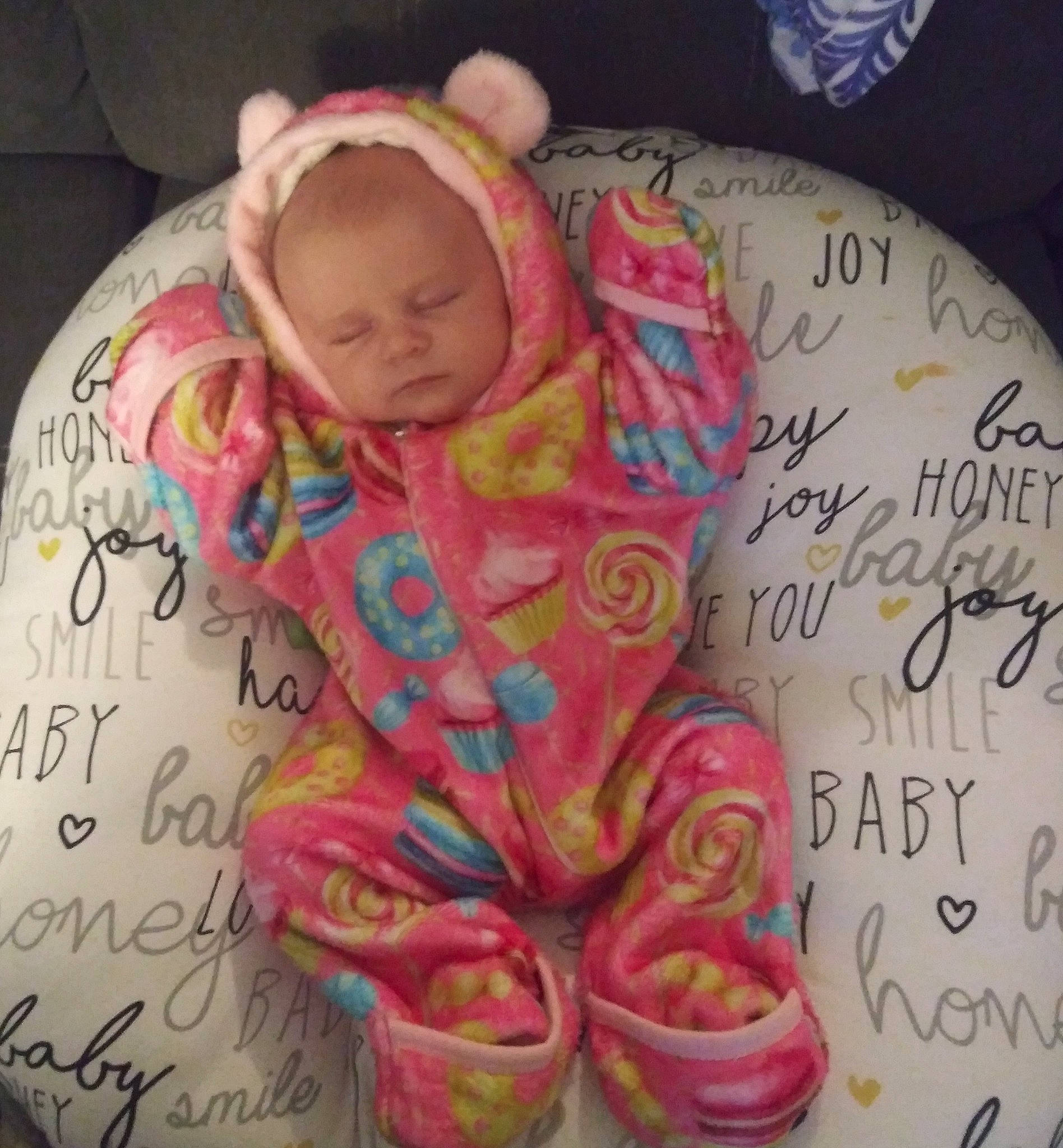 Amelia is registered to the contest to win money with this photo: baby, baby_products, baby_sleeping, baby_toddler_clothing, bonnet, cheek, child, comfort, handwriting, magenta, peach, person, pink