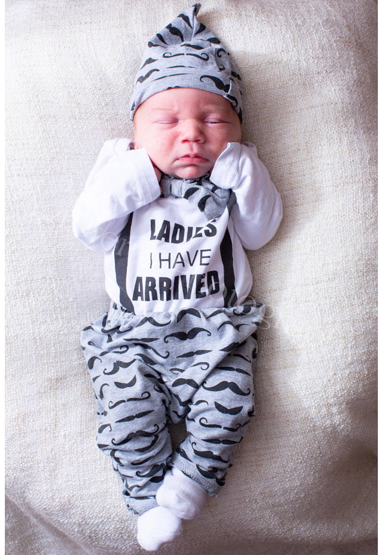 Lance joined the competition — help win amazing prizes! baby, baby_toddler_clothing, beanie, cap, child, face, fashion_accessory, font, fur, grey, happy, headgear, hood, outerwear, pattern, personal_protective_equipment, sleeve, stock_photography, t_shirt, toddler