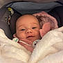 Marie a rejoint le concours — aidez-le/la à gagner de superbes lots ! adorable, baby, blanket, car_seat, child, comfort, cozy, cute, face, indoor, infant, newborn, pacifier, pink_clothing, portrait, smile, soft_texture, warm, wrapped, young