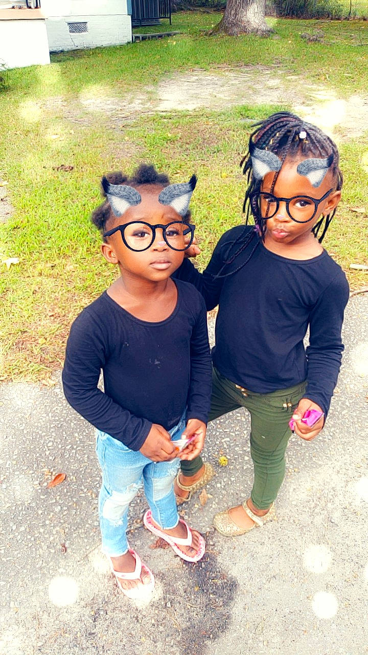 Ashanti is registered to the contest to win money with this photo: child, cool, day, eyewear, fun, girl, glasses, headgear, leisure, outerwear, people, person, personal_protective_equipment, product, recreation, smile, sunglasses, t_shirt, toddler, vacation