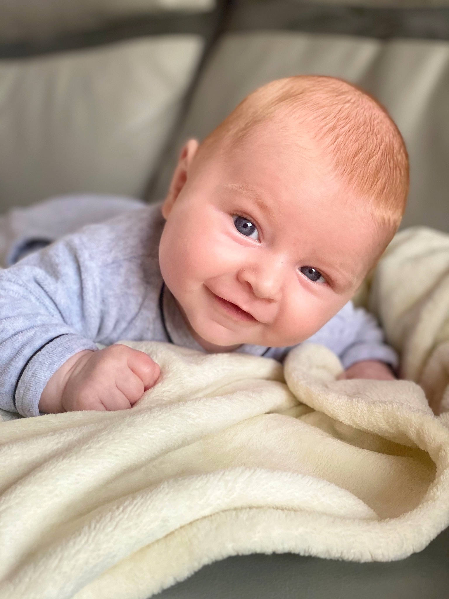 Eloan participe au concours pour gagner de l'argent avec cette photo : baby, baby_toddler_clothing, cheek, child, chin, comfort, eyebrow, face, head, iris, linens, lip, neck, nose, outerwear, person, sitting, skin, sleeve, smile