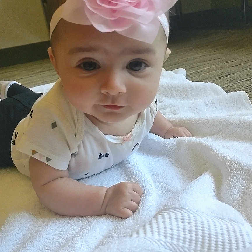 Journee is registered to the contest to win money with this photo: baby, clothing, computerhardware, electronics, face, flower, flowerarrangement, flowerbouquet, hardware, hat, head, monitor, person, petal, photography, plant, portrait, rose, screen, tv