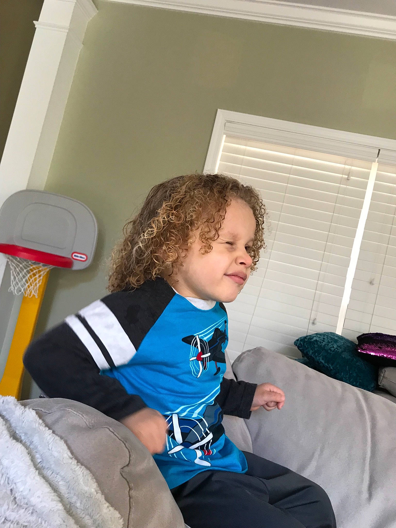 Josiah is registered to the contest to win money with this photo: arm, blue, child, day, fun, furniture, girl, person, product, room, shoulder, sitting, standing, toddler