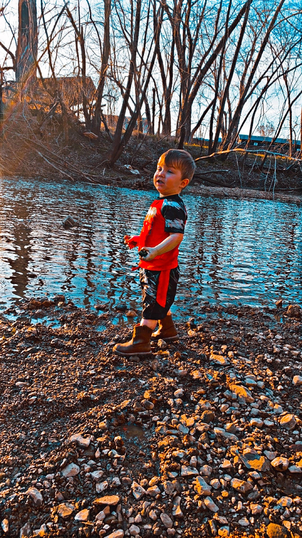 Aryan is registered to the contest to win money with this photo: bank, beauty, body_of_water, branch, deciduous, electric_blue, happy, lake, landscape, leisure, natural_landscape, people_in_nature, person, recreation, sky, sunlight, tree, twig, water, wood