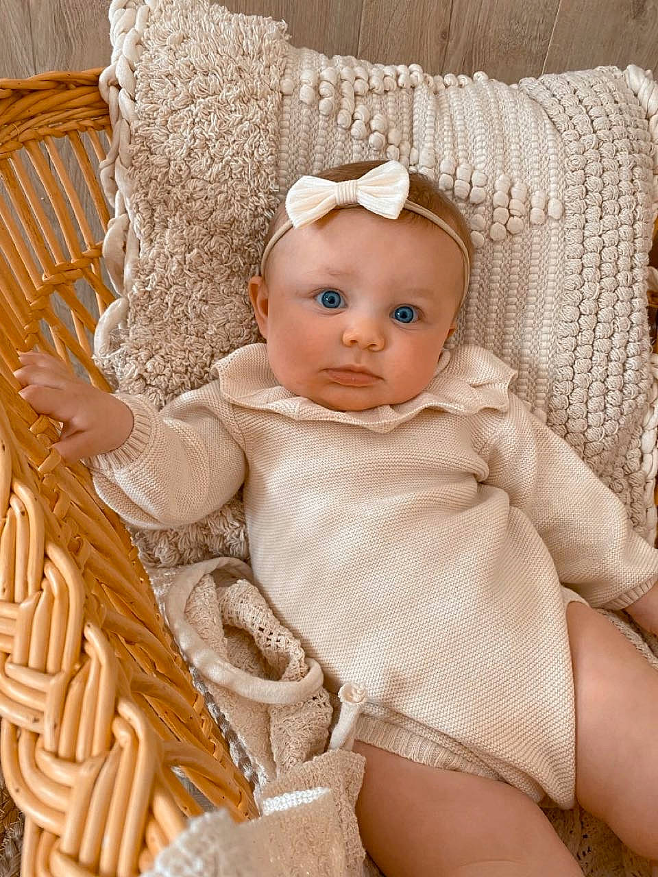 Rafaëla participe au concours pour gagner de l'argent avec cette photo : baby, baby_toddler_clothing, chair, cheek, child, comfort, dress, embellishment, eye, eyelash, hair_accessory, headpiece, iris, jewellery, pattern, person, sitting, skin, textile, toddler