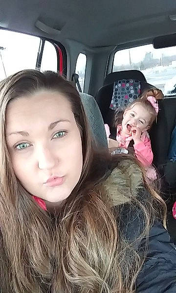 Elliette is registered to the contest to win money with this photo: black_hair, brown_hair, car, car_seat, cheek, child, face, facial_expression, fun, hair, head, lip, long_hair, mouth, nose, person, photography, selfie, skin, smile