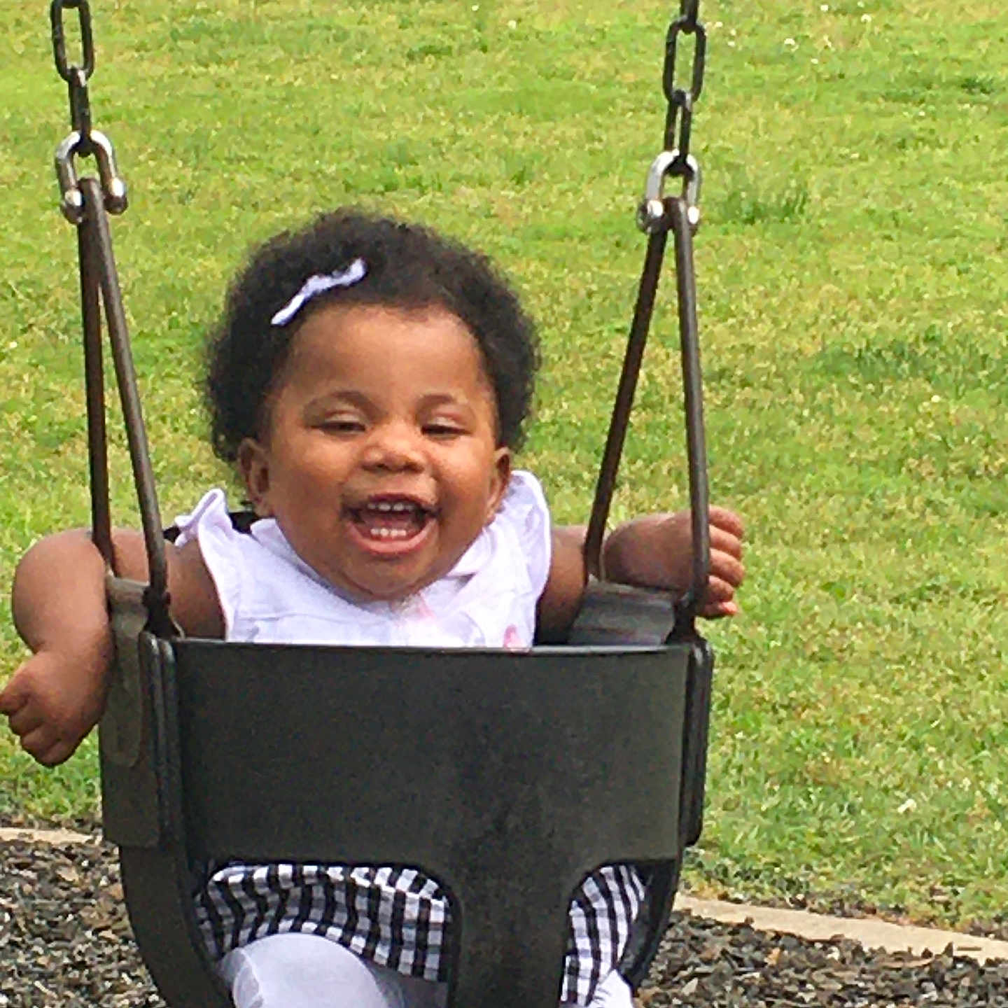 Samonti is registered to the contest to win money with this photo: baby, babylaughing, backyard, face, grass, happy, head, lawn, nature, outdoorplayarea, outdoors, park, person, photography, plant, playarea, portrait, swing, toy, yard