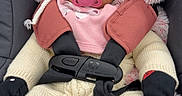 Mariam joined the competition — help win amazing prizes! baby, infant, child, car_seat, harness, pacifier, winter_clothing, knitwear, hat, mittens, pink_blanket, fluffy_blanket, portrait, sitting, indoors, close_up, face, dark_eyes, cozy, safety