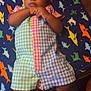 baby, blanket, child, clothing, colorful, cute, fabric, face, feet, floor, hands, indoors, infant, looking_at_camera, lying_down, pastel_colors, pattern, portrait, romper, shark_pattern