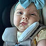 Natalie joined the competition — help win amazing prizes! baby, child, car_seat, headband, blue_bow, face, close_up, straps, safety, infant, cute, expression, skin, seatbelt, clothing, indoors, portrait, person, toddler, child_seat