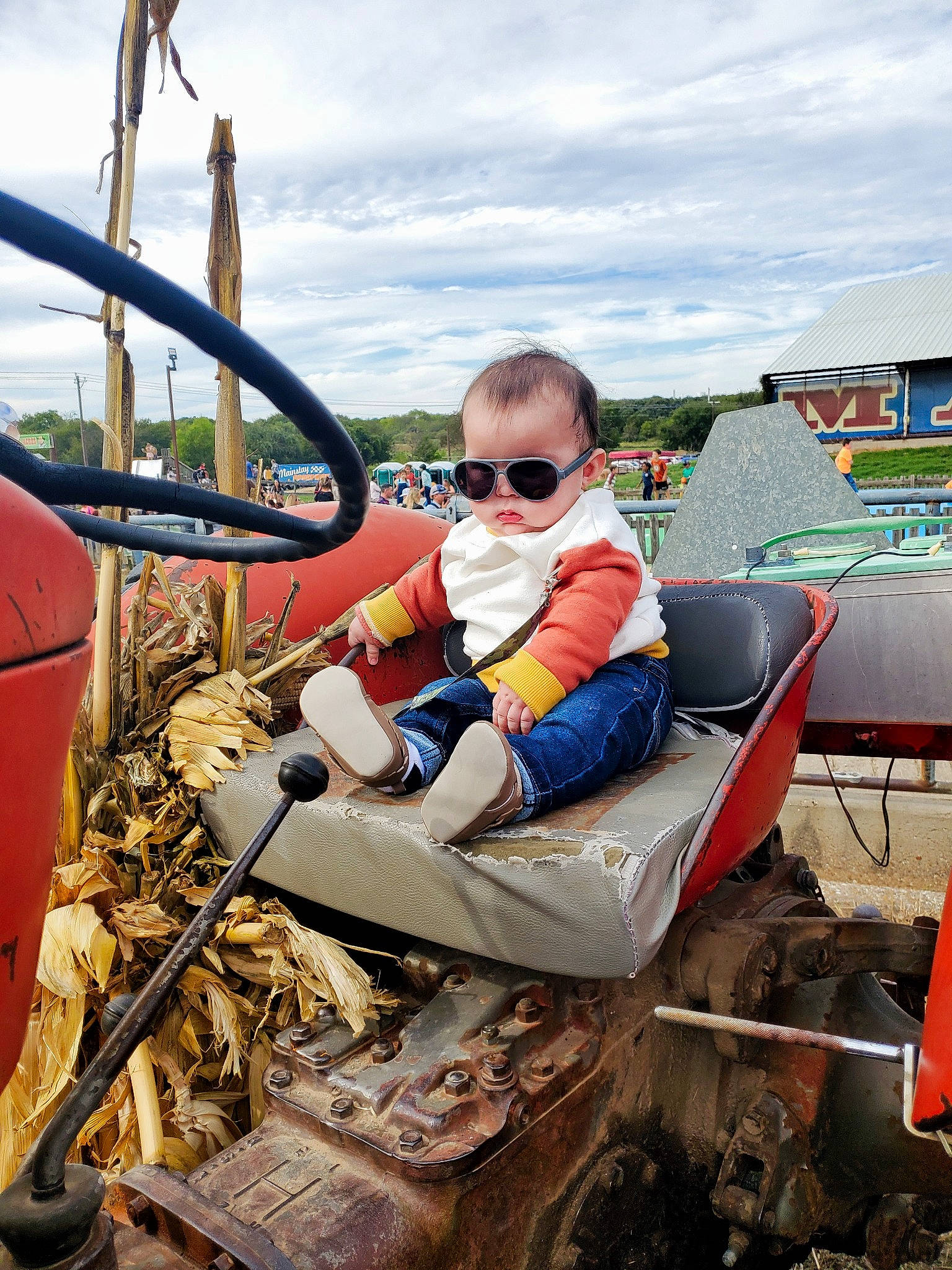 Zeke joined the competition — help win amazing prizes! auto_part, automotive_tire, cloud, eyewear, fun, glasses, goggles, grass, leisure, machine, motor_vehicle, person, personal_protective_equipment, recreation, sitting, sky, steering_wheel, sunglasses, toddler, vision_care