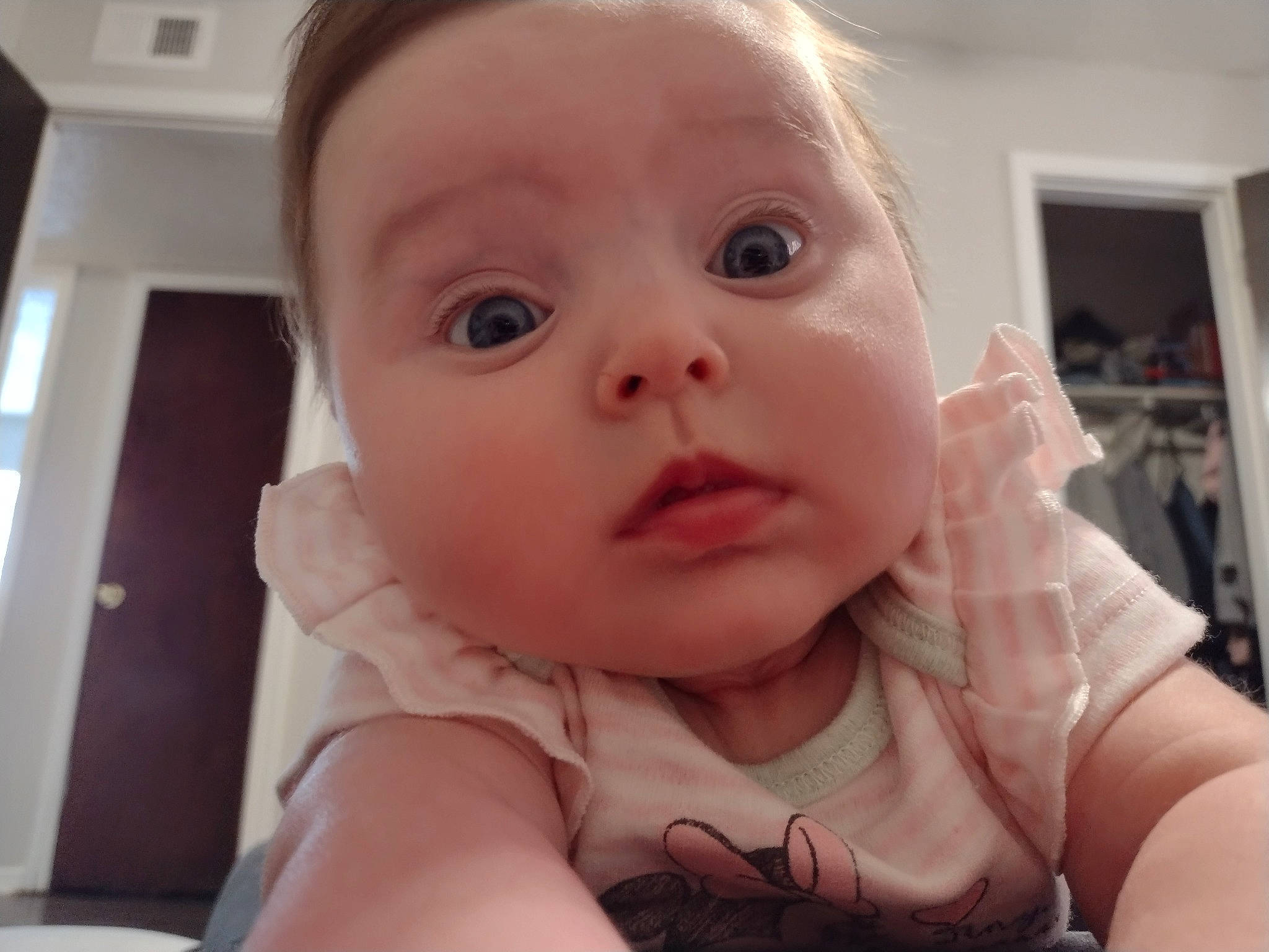 Meadow is registered to the contest to win money with this photo: baby, baby_toddler_clothing, cheek, child, comfort, ear, eyelash, finger, fun, gesture, happy, iris, lip, mouth, nail, nose, person, skin, sleeve, surprise