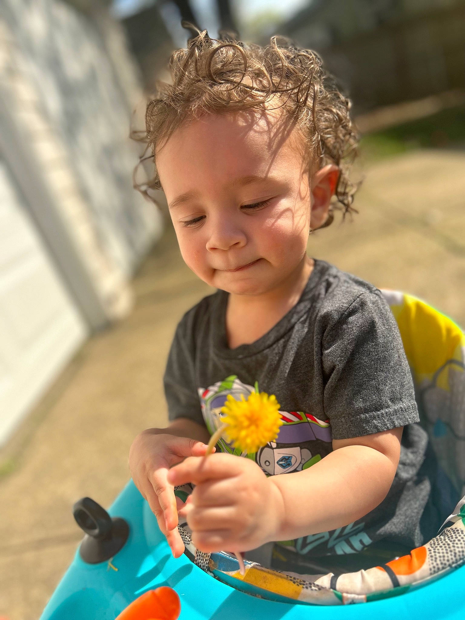 Jadiel joined the competition — help win amazing prizes! arm, child, finger, flower, fun, grass, happy, iris, leisure, people_in_nature, person, petal, plant, recreation, sitting, skin, smile, summer, t_shirt, toddler