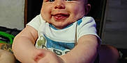 Noah is registered to the contest to win money with this photo: baby, cheerful, child, clothing, cute, expression, face, hands, happy, holding, human, indoor, infant, joy, person, portrait, short_sleeves, skin, smiling, toddler