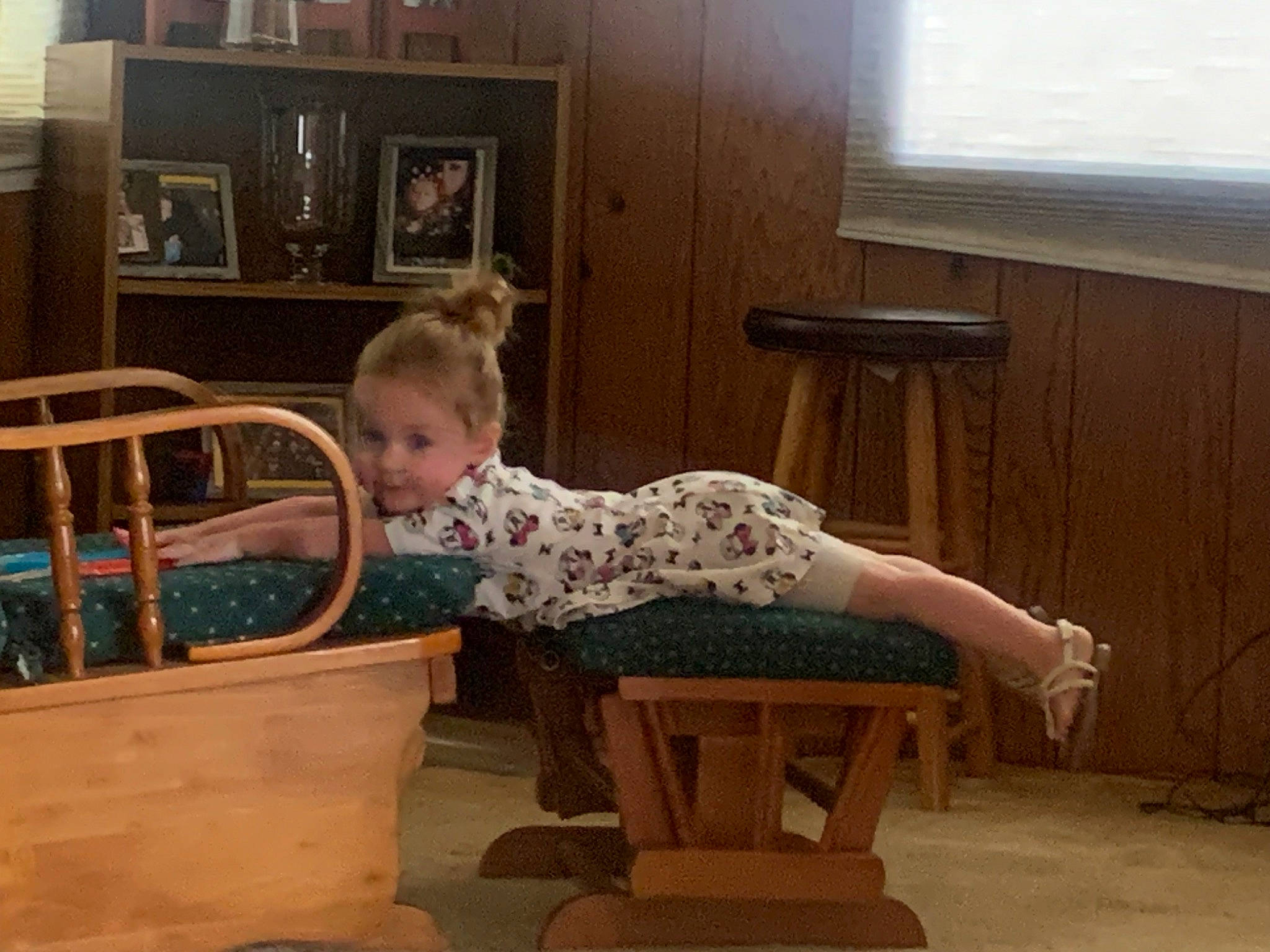 Jocelynn is registered to the contest to win money with this photo: baby, baby_products, baby_toddler_clothing, chair, child, comfort, flooring, furniture, hardwood, infant_bed, person, picture_frame, play, room, shelf, sitting, t_shirt, table, toddler, window