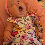 Novella joined the competition — help win amazing prizes! adorable, baby, child, clothing, colorful, comfort, cushion, cute, expression, floral_dress, headwear, indoors, infant, lying_down, person, pink_headband, portrait, small_hands, soft_fabric, young